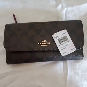 Dark brown and Magenta Coach Wallet